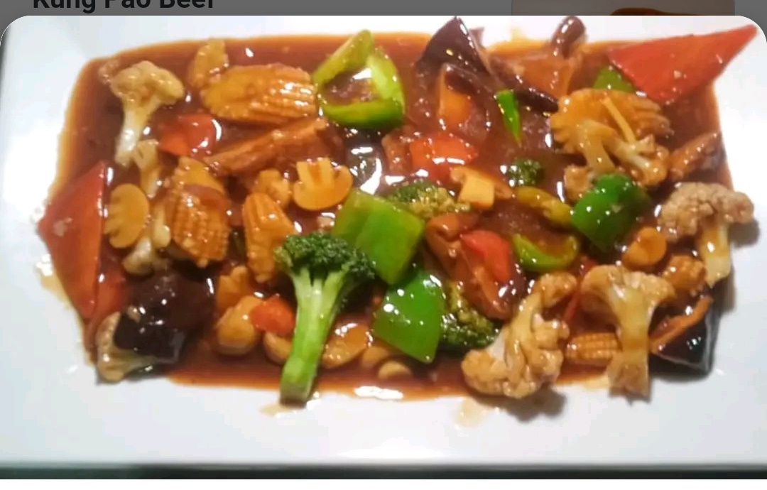 65B Beef with Baby Corn and Mushrooms.